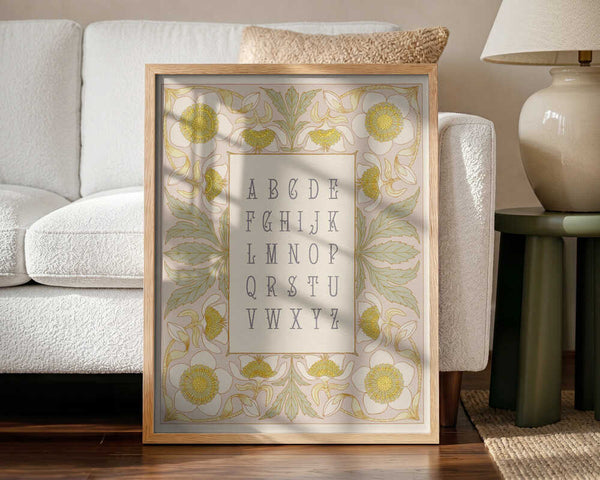 Framed Elegant Floral Alphabet print displayed in a vintage botanical nursery.