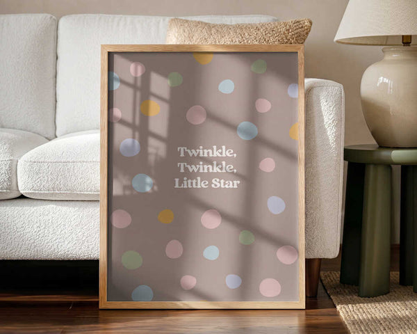 Framed Twinkle Little Star nursery print displayed above a nursing chair.