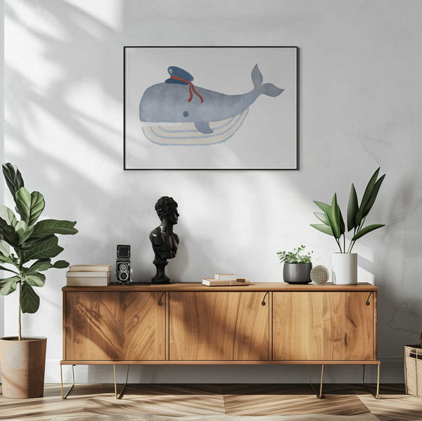 Framed Little Captain Whale ocean nursery print displayed in a nautical baby room.