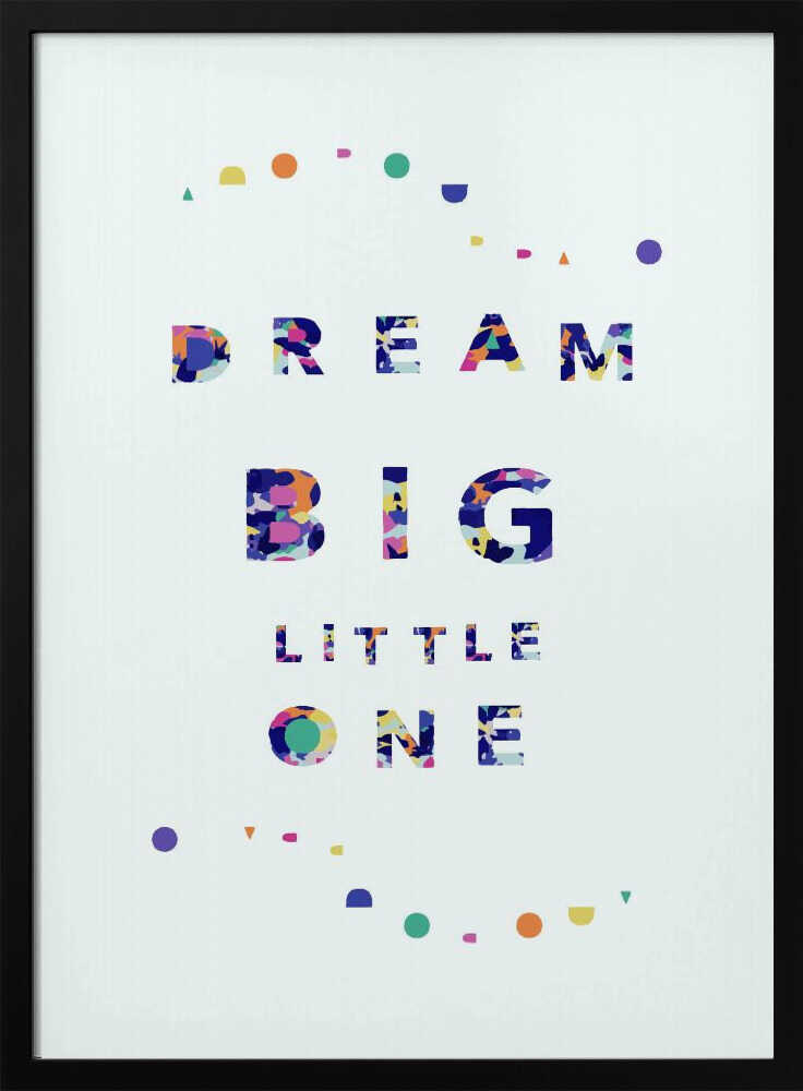 Framed Dream Big Little One nursery print displayed above a cot in a colourful nursery.
