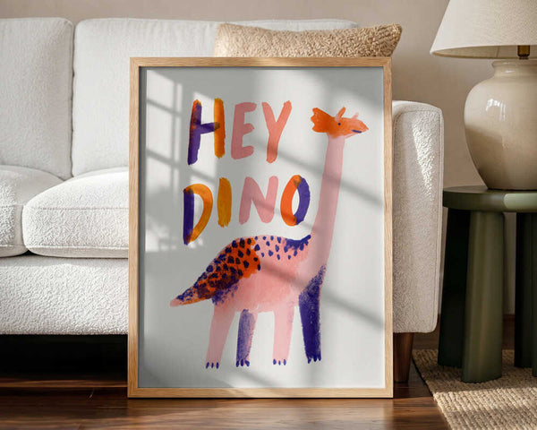 Framed Hey Dino Illustration print displayed in a bright, playful nursery.