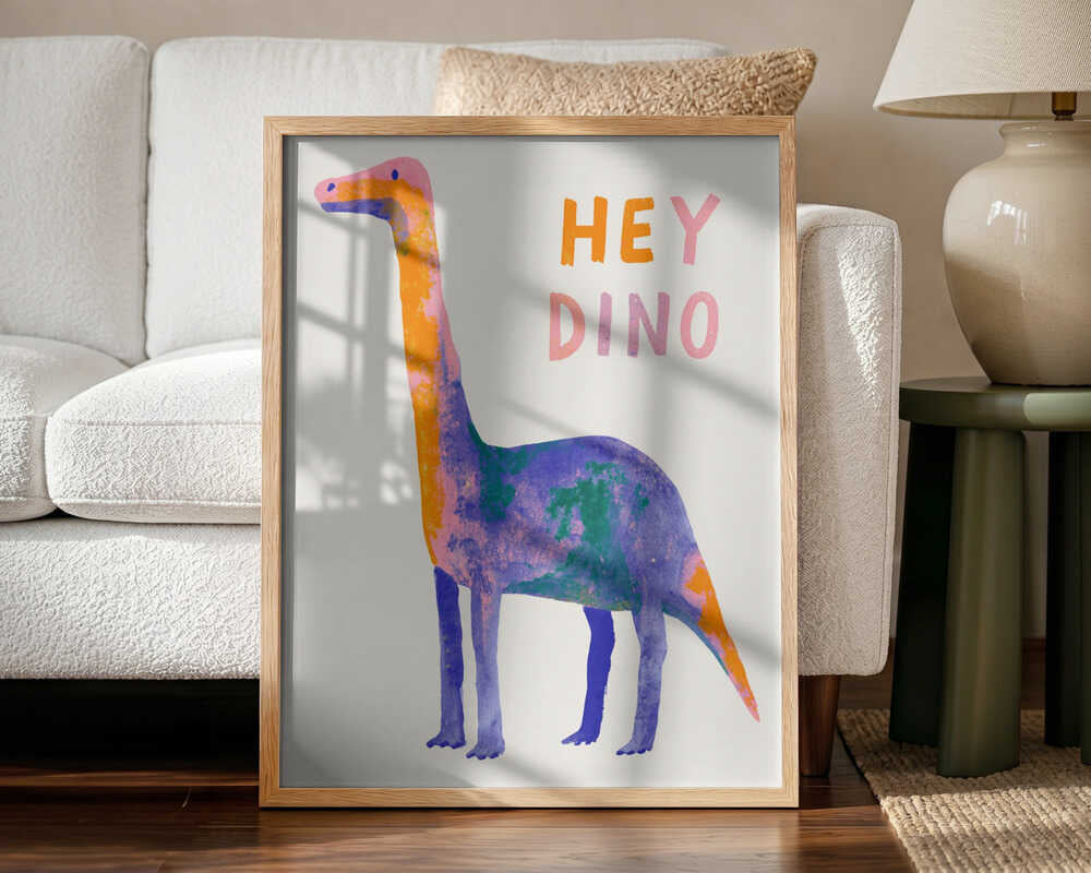 Framed Friendly Colorful Dino print displayed in a modern dinosaur-themed nursery.