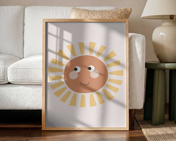 Framed Happy Smiling Sun nursery print displayed in a boho-style baby room.