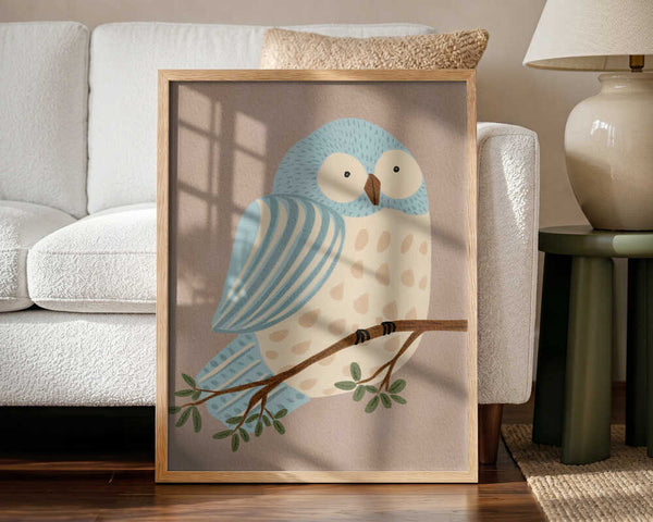 Framed Whimsical Blue Owl bird nursery print displayed in a woodland-themed nursery.
