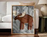 Framed Cute Woodland Moose print displayed in a Scandinavian-style nursery.