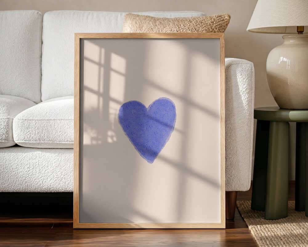 Framed Simple Blue Heart nursery print displayed in a neutral baby room.