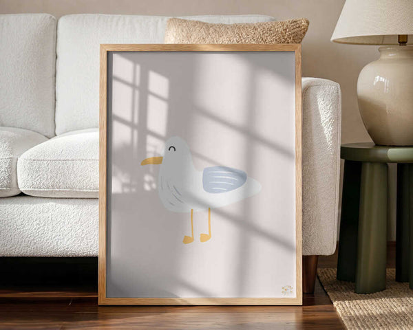 Framed Happy Little Seagull bird nursery print displayed in a coastal nursery.