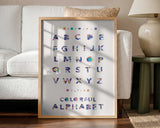 Framed Colorful Abstract Alphabet print displayed in a playroom setting.