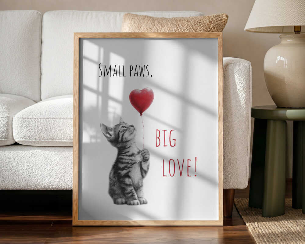 Framed Small Paws Big Love animal nursery print displayed above a nursing chair.