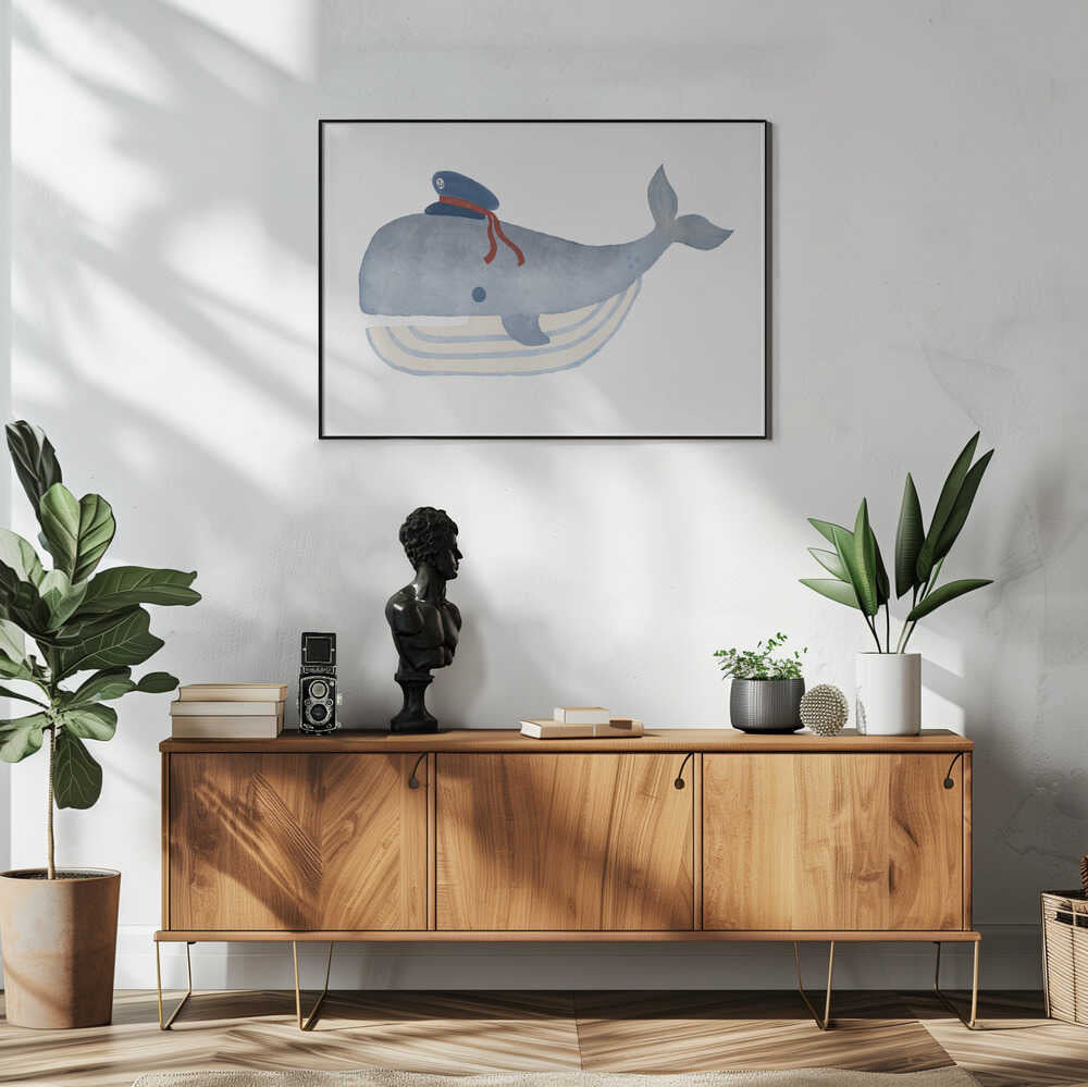 Framed Little Captain Whale ocean nursery print displayed in a nautical baby room.