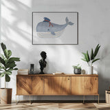 Framed Little Captain Whale ocean nursery print displayed in a nautical baby room.
