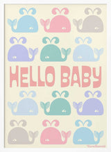Framed Hello Baby Whales ocean nursery print displayed above a cot.