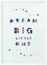 Framed Dream Big Little One nursery print displayed above a cot in a colourful nursery.